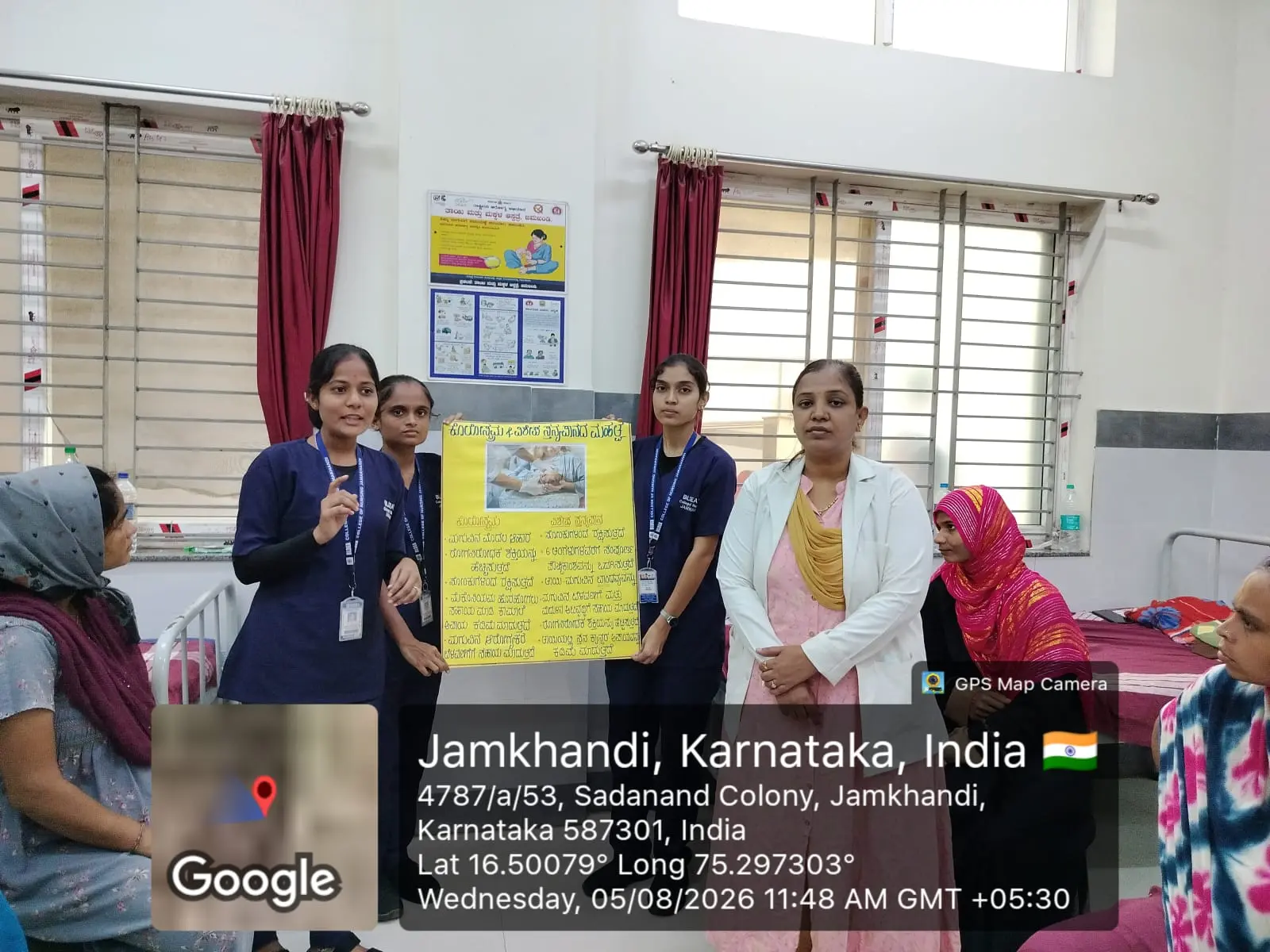 Group photograph of Eighth Semester B Sc Nursing students with ANC and PNC mothers after breastfeeding awareness programme Jamkhandi