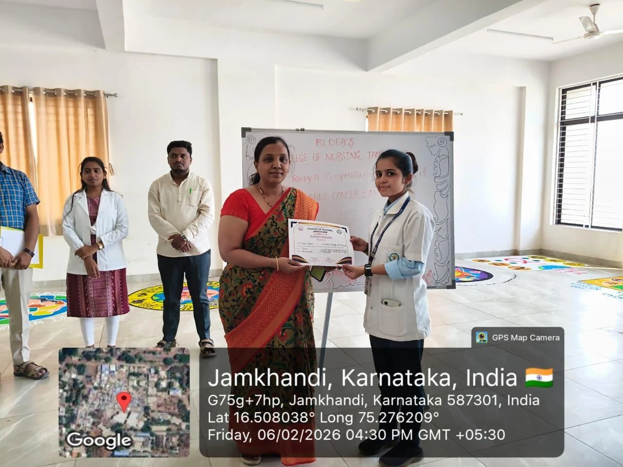 Certificate presented to first prize winner – World Cancer Day 2026, BLDEA College of Nursing Jamkhandi