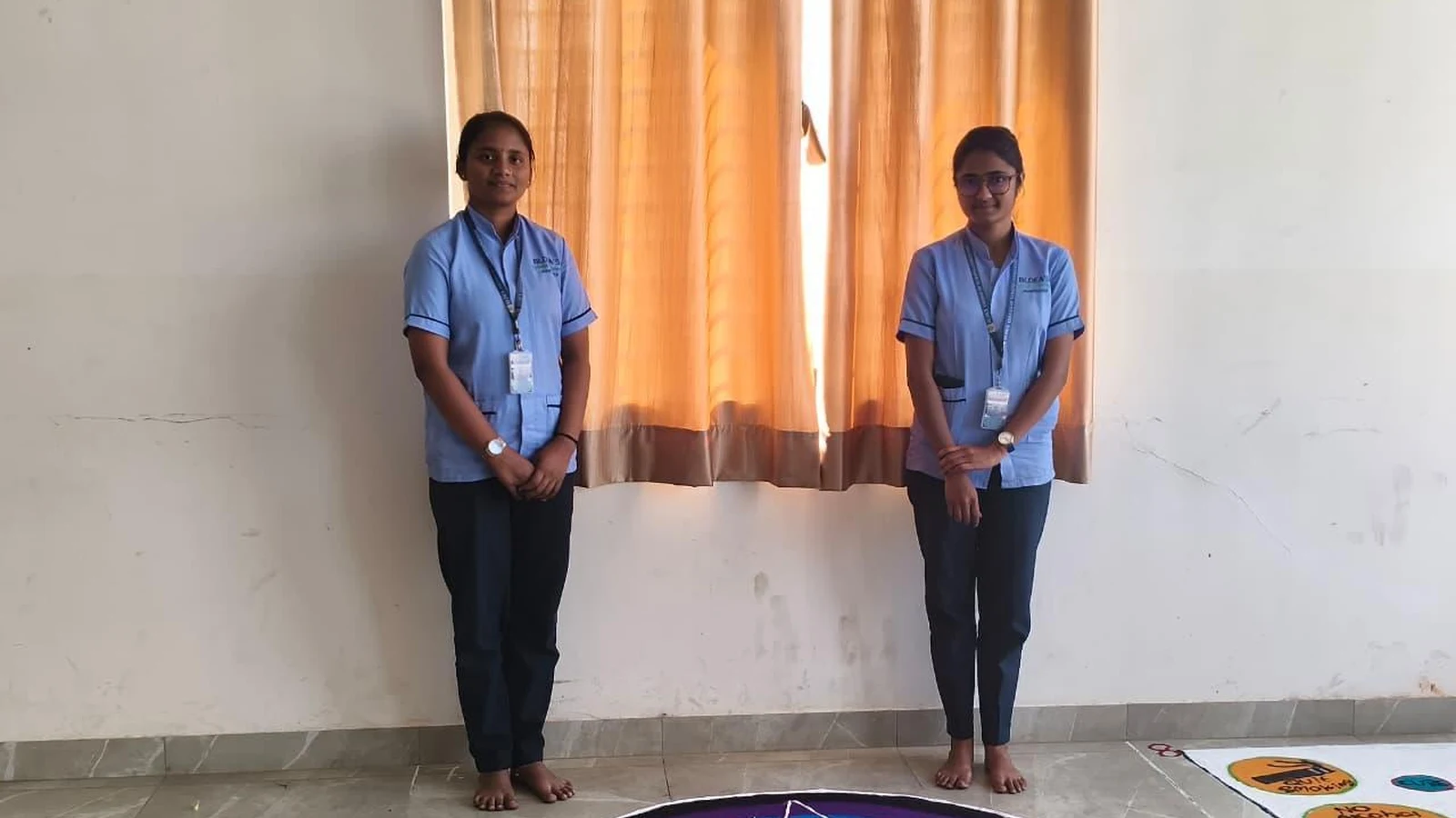 BLDEA College of Nursing Jamkhandi students presenting their World Cancer Day themed rangoli design during Rangoli Presentation Competition on 6th February 2026 theme United by Unique